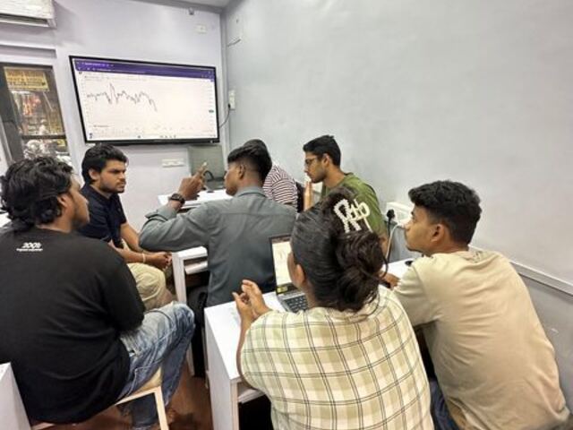 Students learning in a Smart Mind Trading's classroom