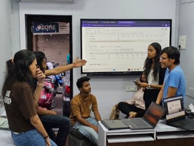 Students discussing a chart in class